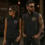 Homme et femme style biker portant gilet softshell sans manches Dream Vallée Chapter France en garage moto ambiance Harley